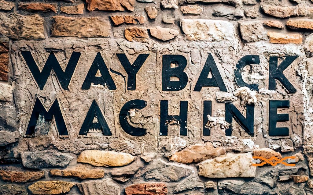 Wayback Machine Bold Black Letters Inlaid Into Handbuilt Stone Wall With Heavy Mortar